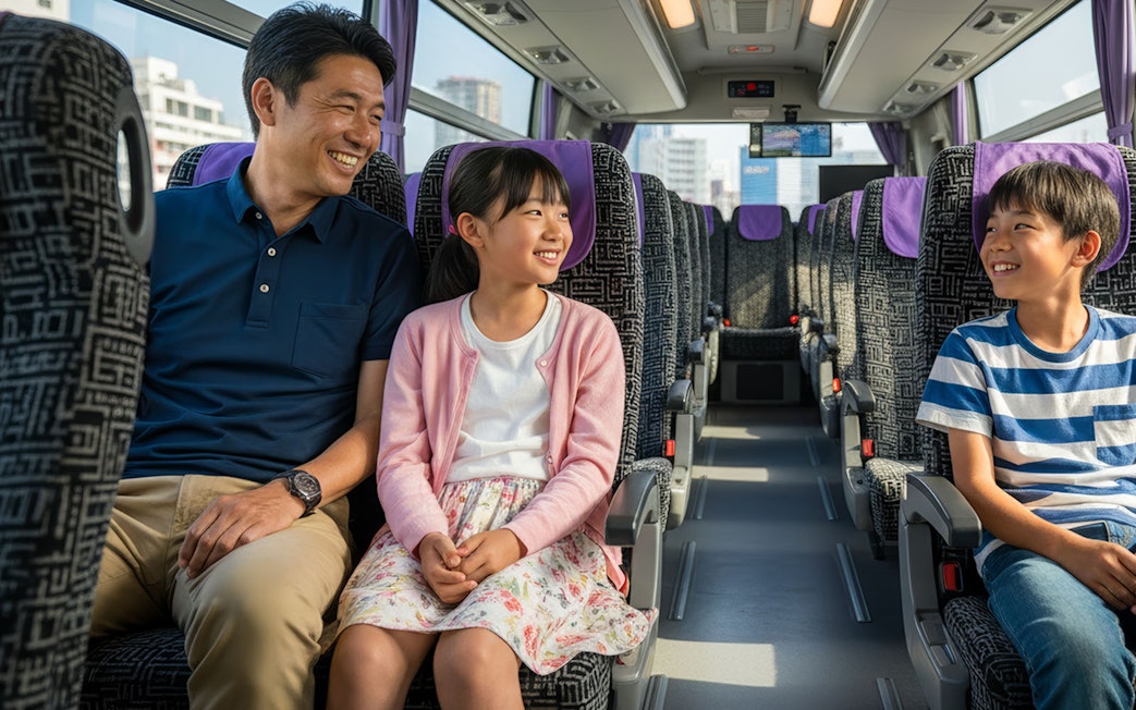 Family enjoying bus transfer from Kansai Airport to Kyoto.