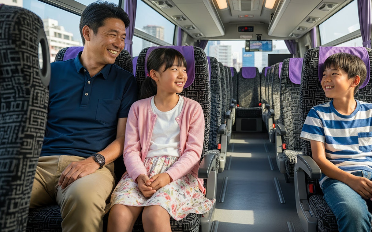 Family enjoying bus transfer from Kansai Airport to Kyoto.