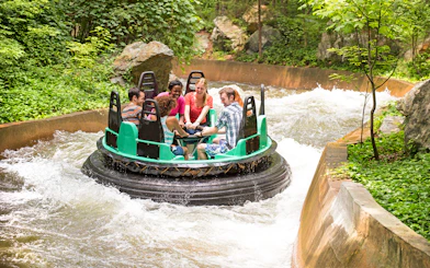 Rafting ride at Six Flags King's Dominion White Water Canyon with people enjoying the rapids.