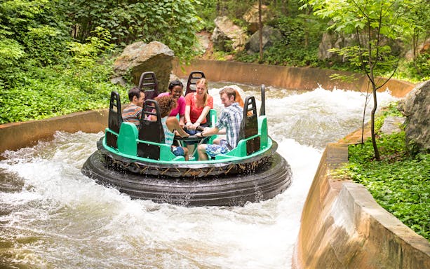 Rafting ride at Six Flags King's Dominion White Water Canyon with people enjoying the rapids.