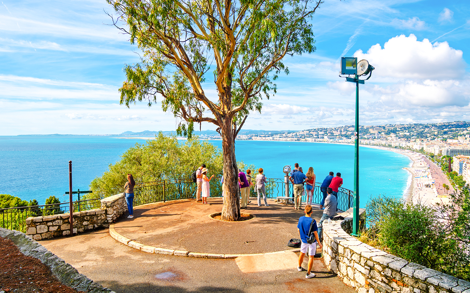 Visitors enjoying the view from Castle Hill, Nice overlooking the Mediterranean Sea.