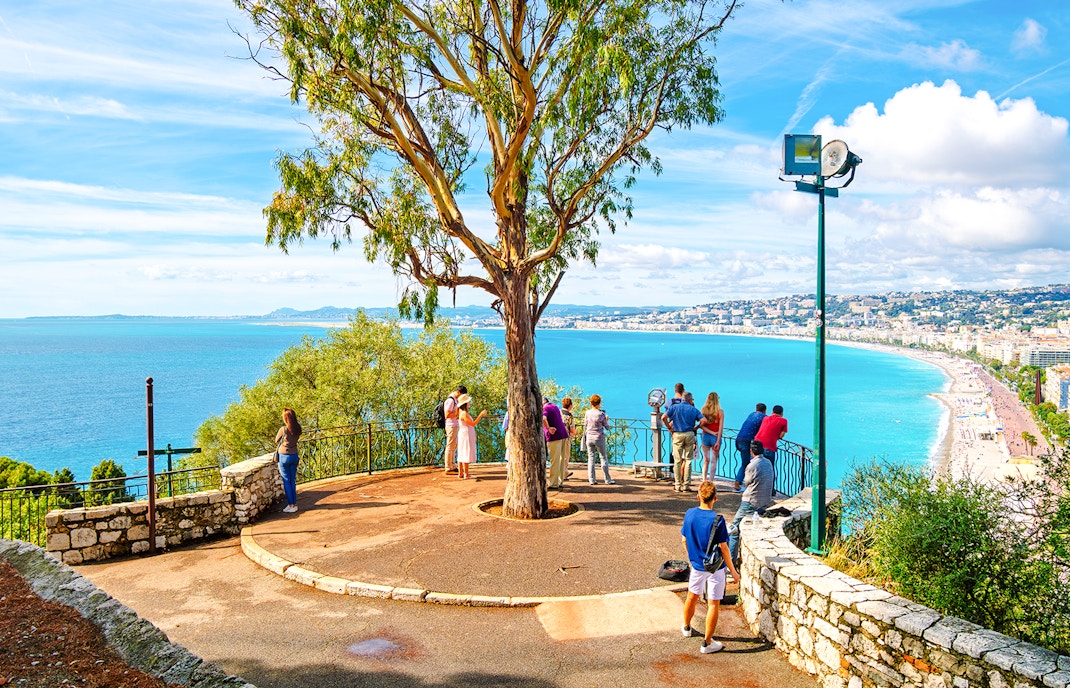 Visitors enjoying the view from Castle Hill, Nice overlooking the Mediterranean Sea.