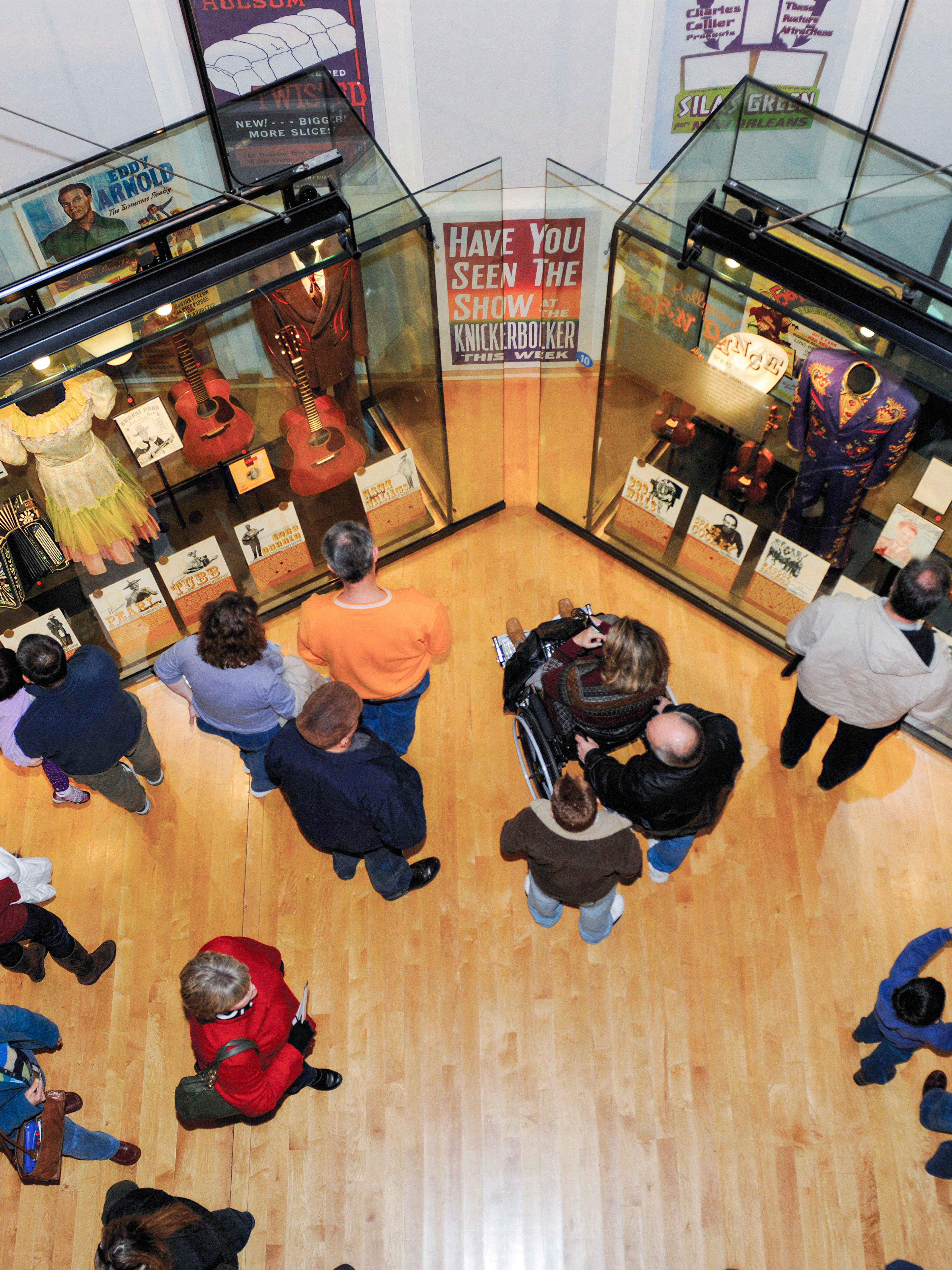 Visitors viewing exhibits on the second floor of the Country Music Hall of Fame in Nashville, Tennessee.