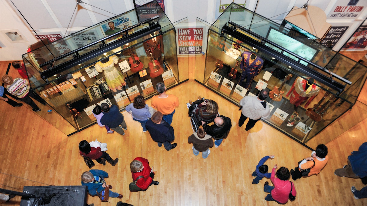 Visitors viewing exhibits on the second floor of the Country Music Hall of Fame in Nashville, Tennessee.