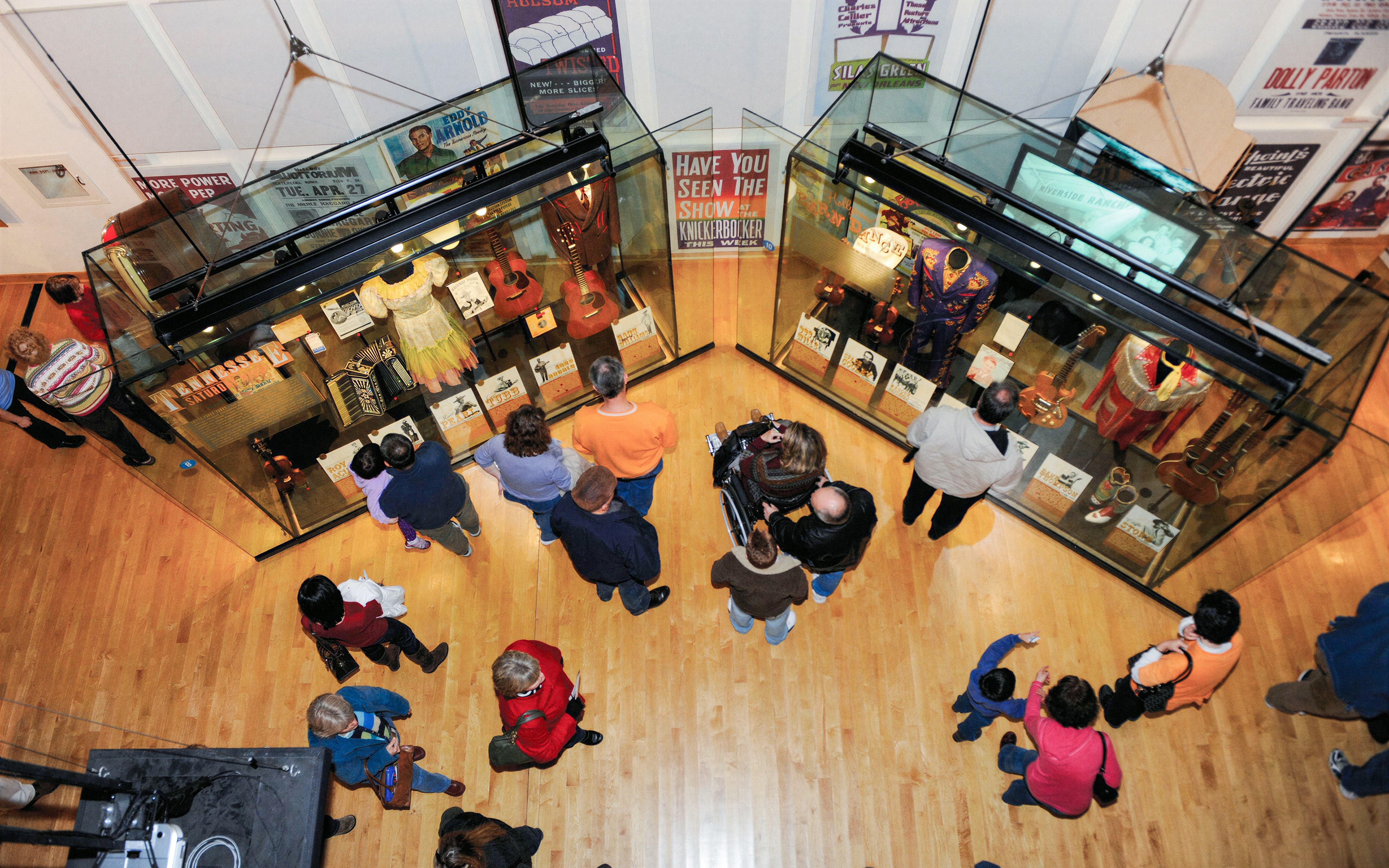 Visitors viewing exhibits on the second floor of the Country Music Hall of Fame in Nashville, Tennessee.