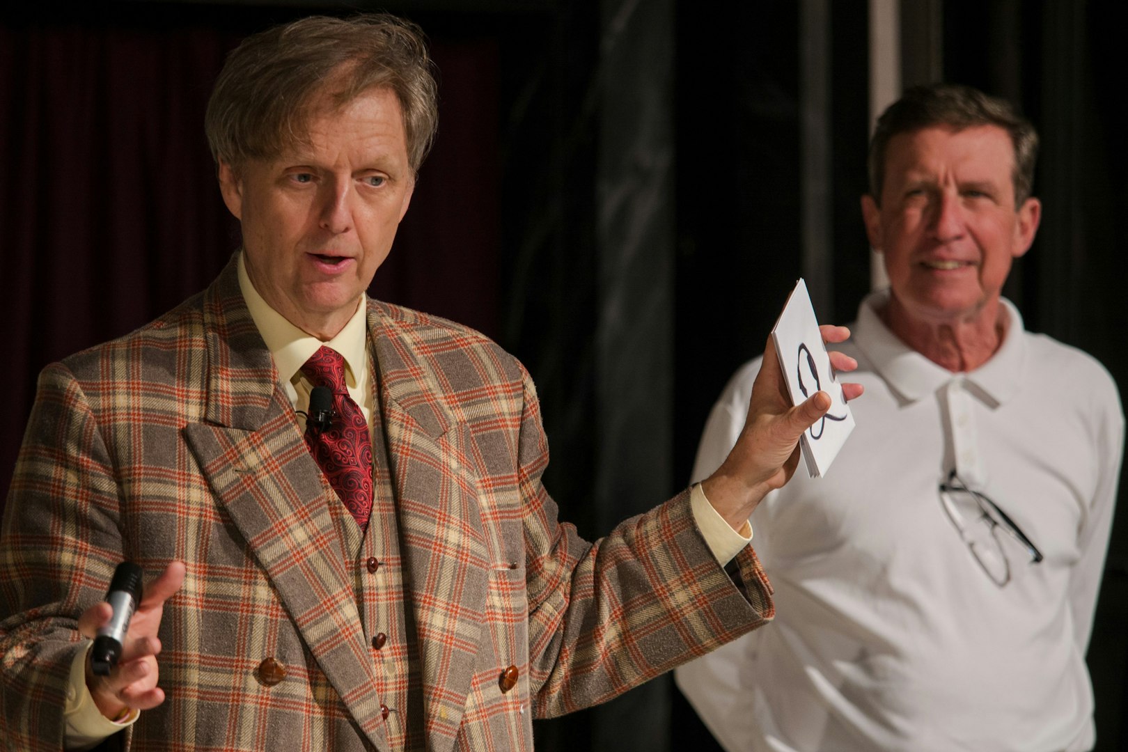 Magician performing card trick at The Mac King Comedy Magic Show, Vegas.