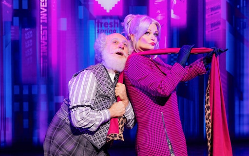 Elderly man and woman in vibrant costumes performing in BOOP! The Betty Boop Musical.