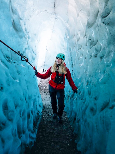 Guest exploring Blue Ice Cave in Vatnajökull, Iceland.