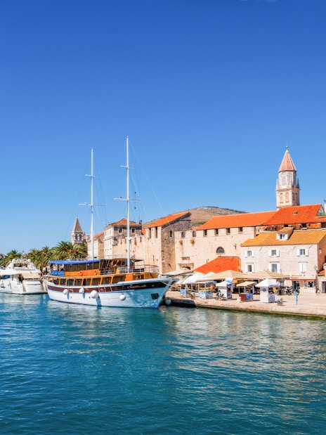 Trogir waterfront with boats docked along Obala bana Berislavića 30, Croatia.