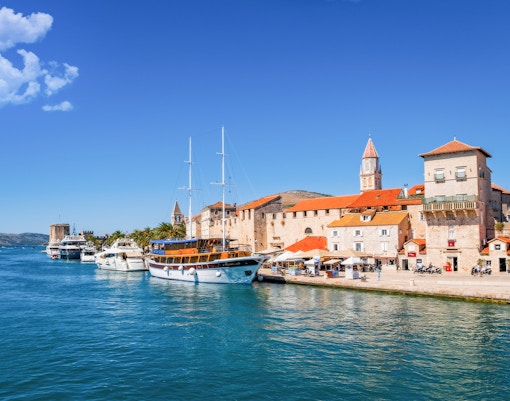 Trogir waterfront with boats docked along Obala bana Berislavića 30, Croatia.