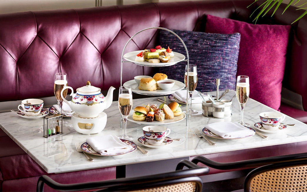 Afternoon tea set with pastries and sandwiches on a Seattle to Victoria ferry.