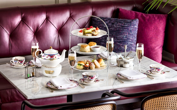 Afternoon tea set with pastries and sandwiches on a Seattle to Victoria ferry.