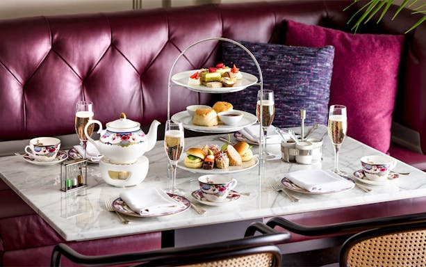 Afternoon tea set with pastries and sandwiches on a Seattle to Victoria ferry.