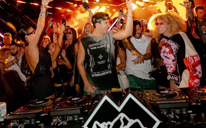 Crowd enjoying John Summit's DJ performance in Ibiza nightclub.