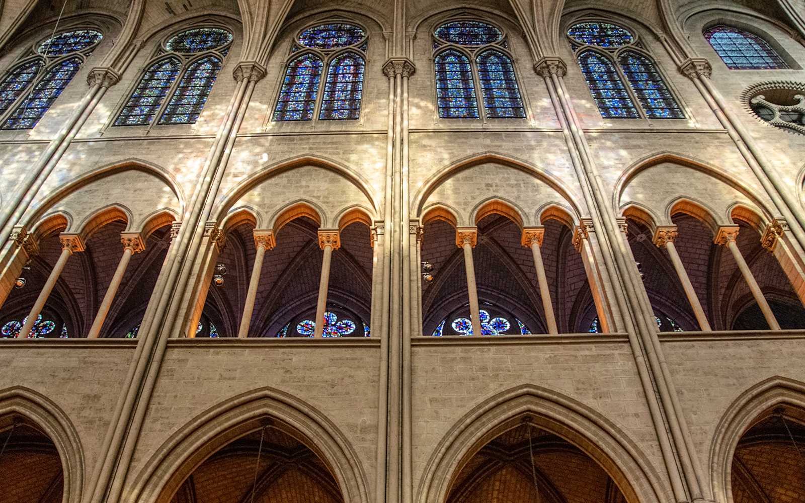 Galleries inside Notre Dame Cathedral showcasing intricate Gothic architecture.
