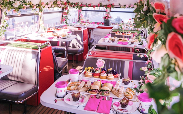 Afternoon tea setup with sandwiches and pastries on Brigit’s Bakery bus tour.