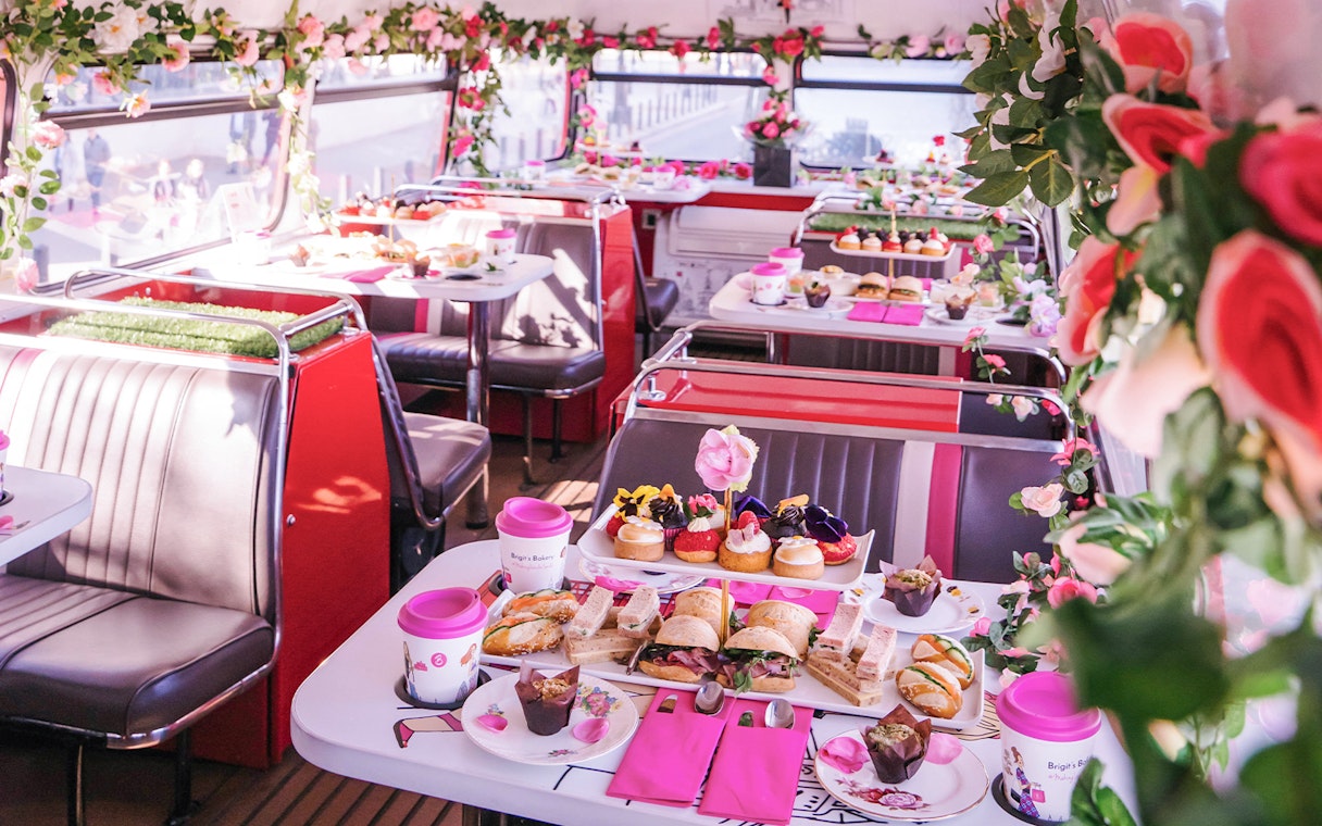 Afternoon tea setup with sandwiches and pastries on Brigit’s Bakery bus tour.