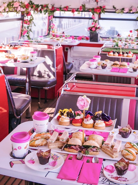 Afternoon tea setup with sandwiches and pastries on Brigit’s Bakery bus tour.