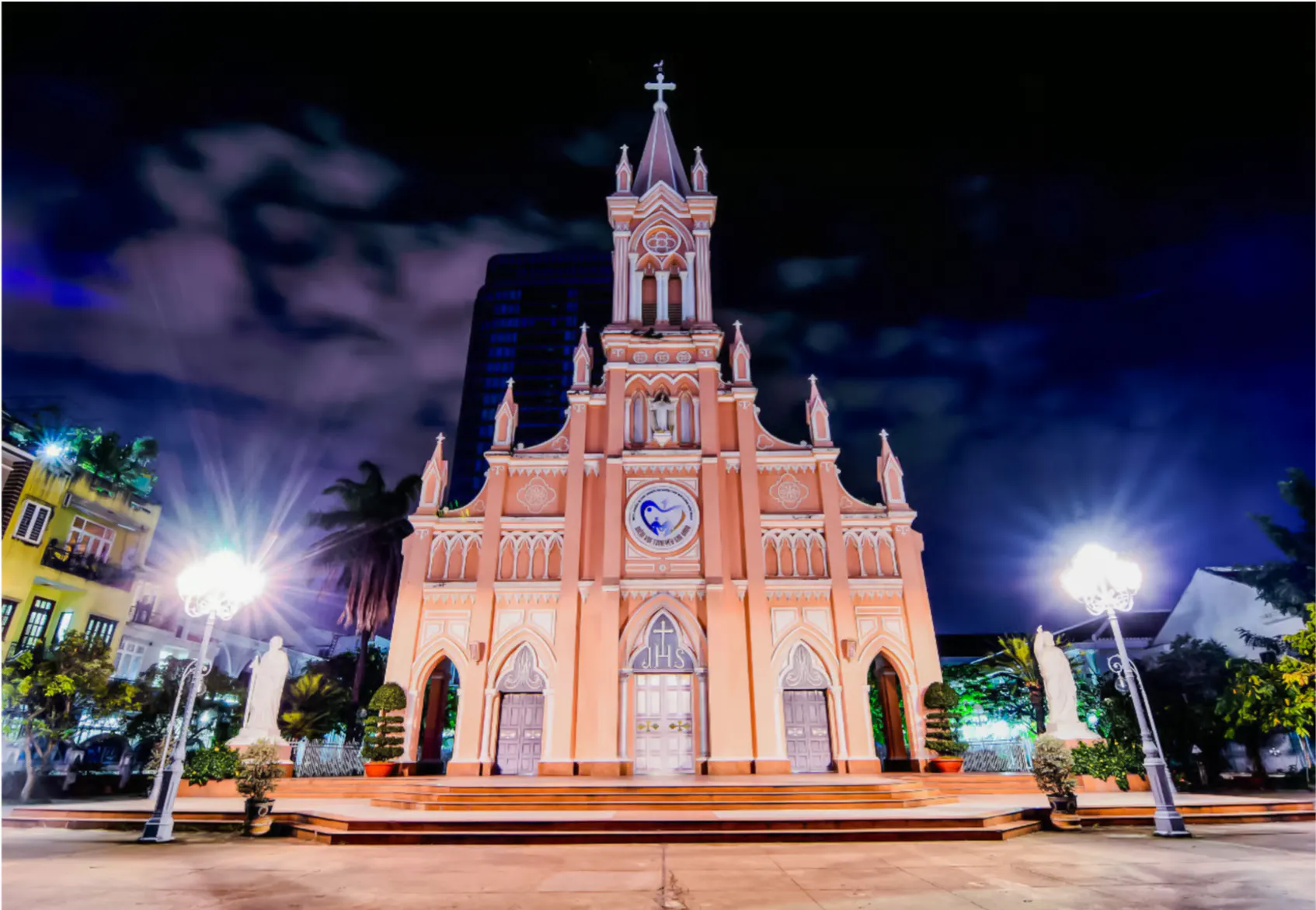 Da Nang Cathedral illuminated at night during a sightseeing tour.