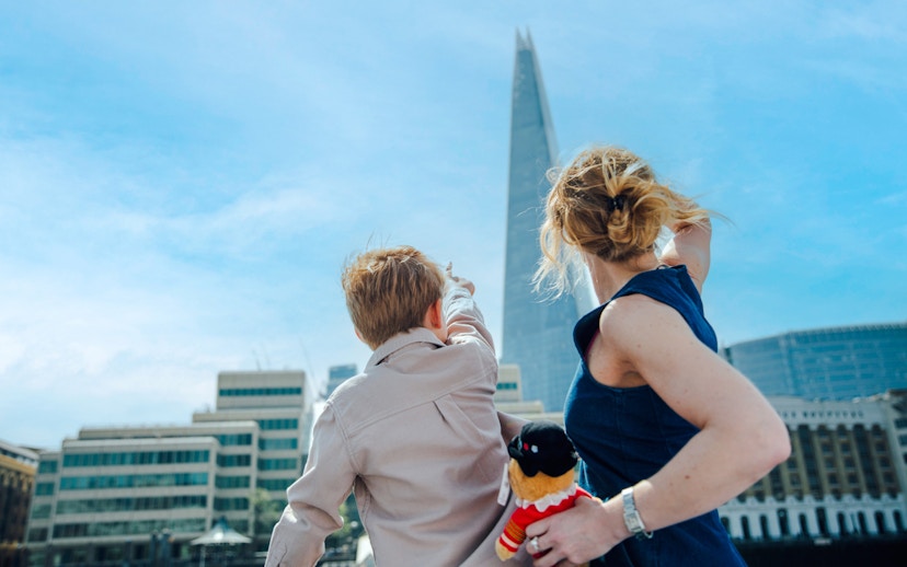 Guests on Tower of London Cruise pointing at the Shard in London.