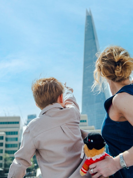 Guests on Tower of London Cruise pointing at the Shard in London.