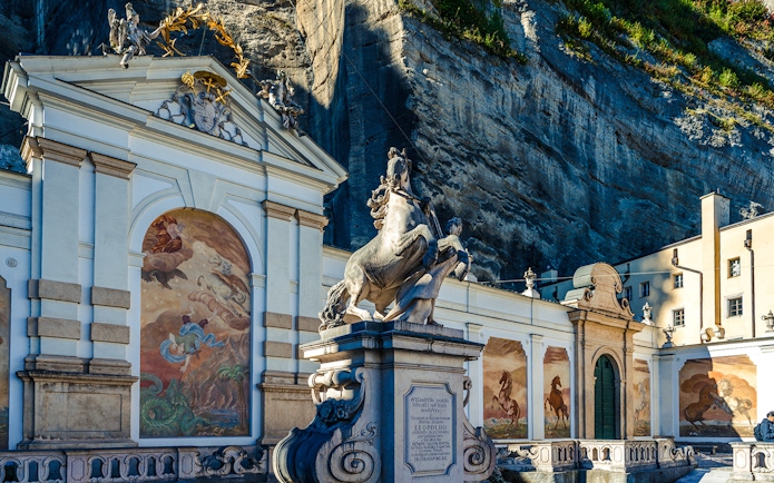 Equestrian statue and frescoes at the Horse Pond in Salzburg, Austria.