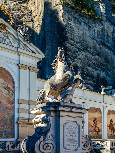 Equestrian statue and frescoes at the Horse Pond in Salzburg, Austria.