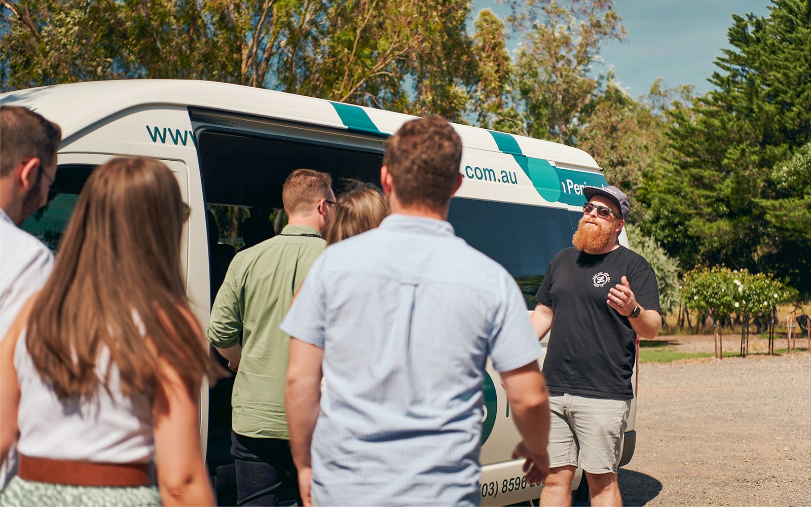 Tour group boarding a van for a hop on hop off experience in Yarra Valley.