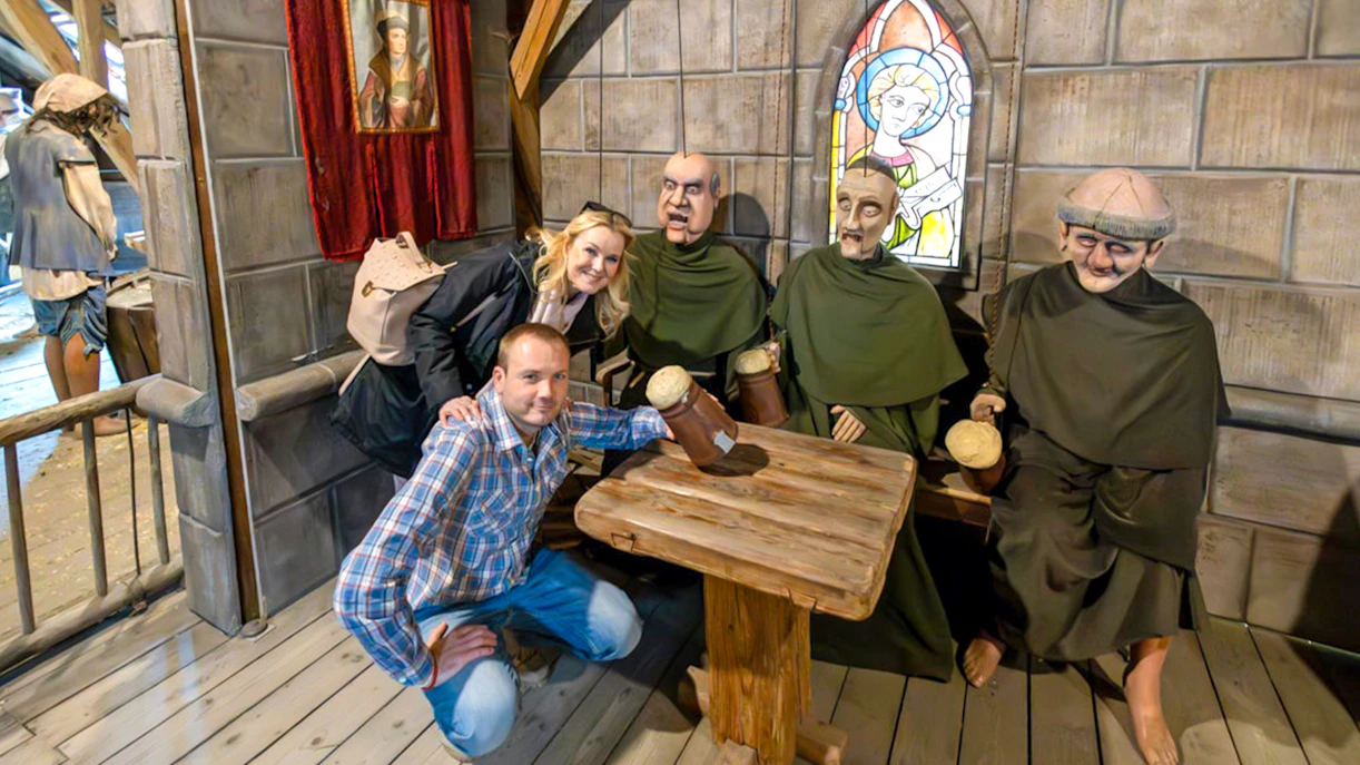 Medieval-themed dinner show with costumed figures at Dětenice Brewery near Prague.