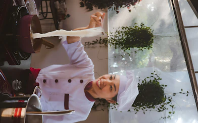 Chef making noodles during Hoi An cooking class experience.