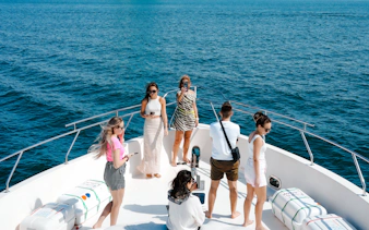 Group enjoying a yacht tour on Dubai Harbour.