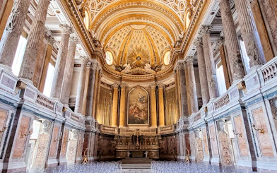 Palatine Chapel interior with ornate ceiling and columns, Royal Palace of Caserta, Italy.