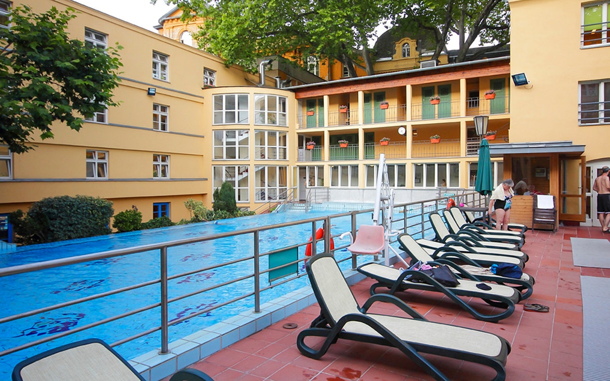 Lounge chairs by the pool at Lukacs Spa, Budapest.