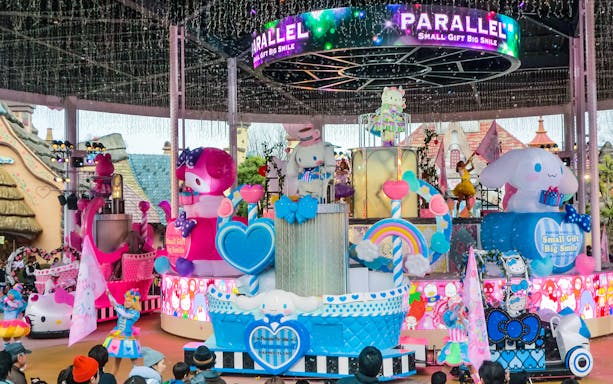 Sanrio Harmonyland parade with colorful character floats and performers in Japan.