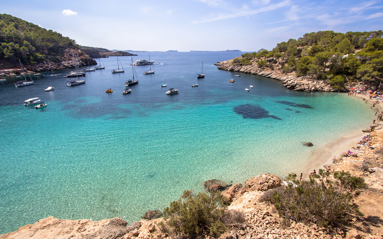 Aerial view of turquoise blue water and sand at Illes Balears, Spain