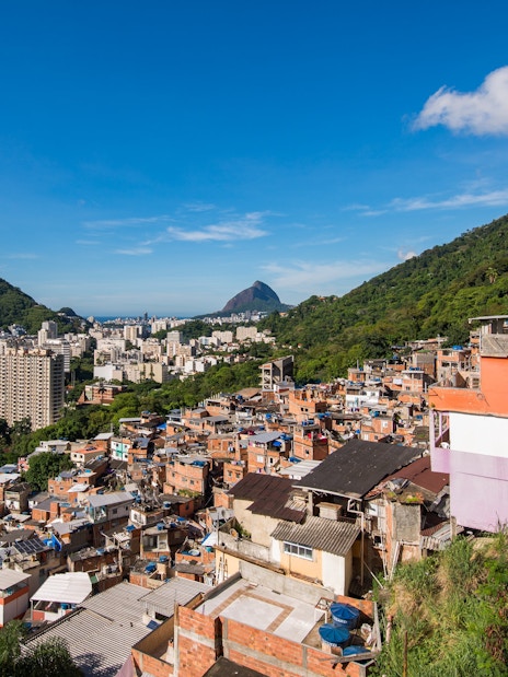 Houses of Santa Marta Favela with Corcovado Mountain in Rio de Janeiro in the background.
