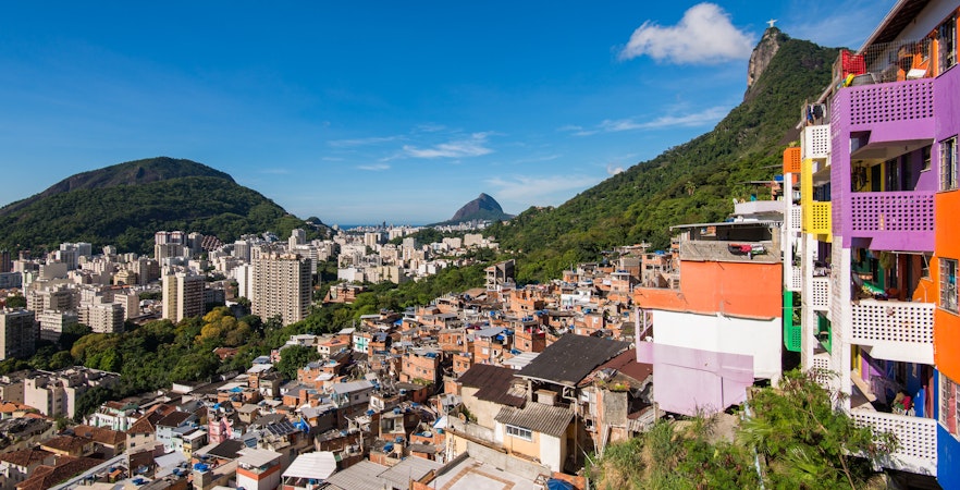 Houses of Santa Marta Favela with Corcovado Mountain in Rio de Janeiro in the background.