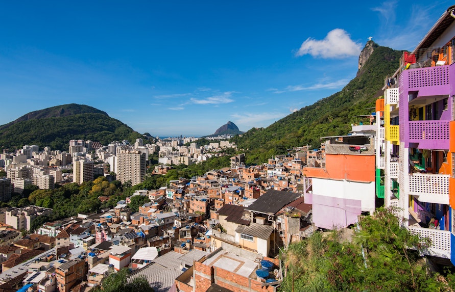 Houses of Santa Marta Favela with Corcovado Mountain in Rio de Janeiro in the background.