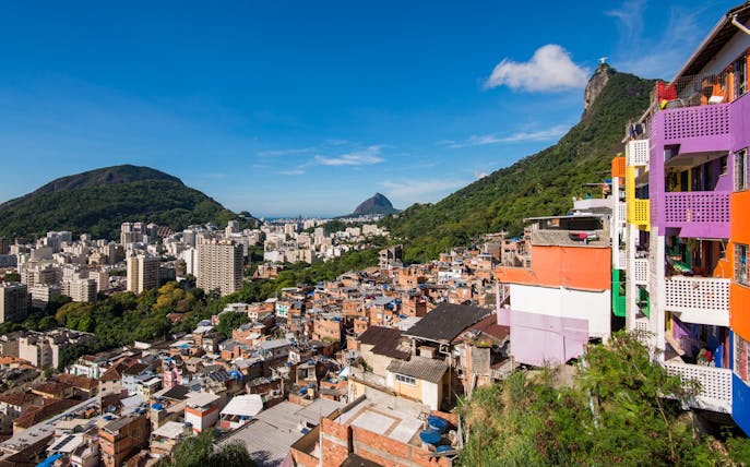 Houses of Santa Marta Favela with Corcovado Mountain in Rio de Janeiro in the background.
