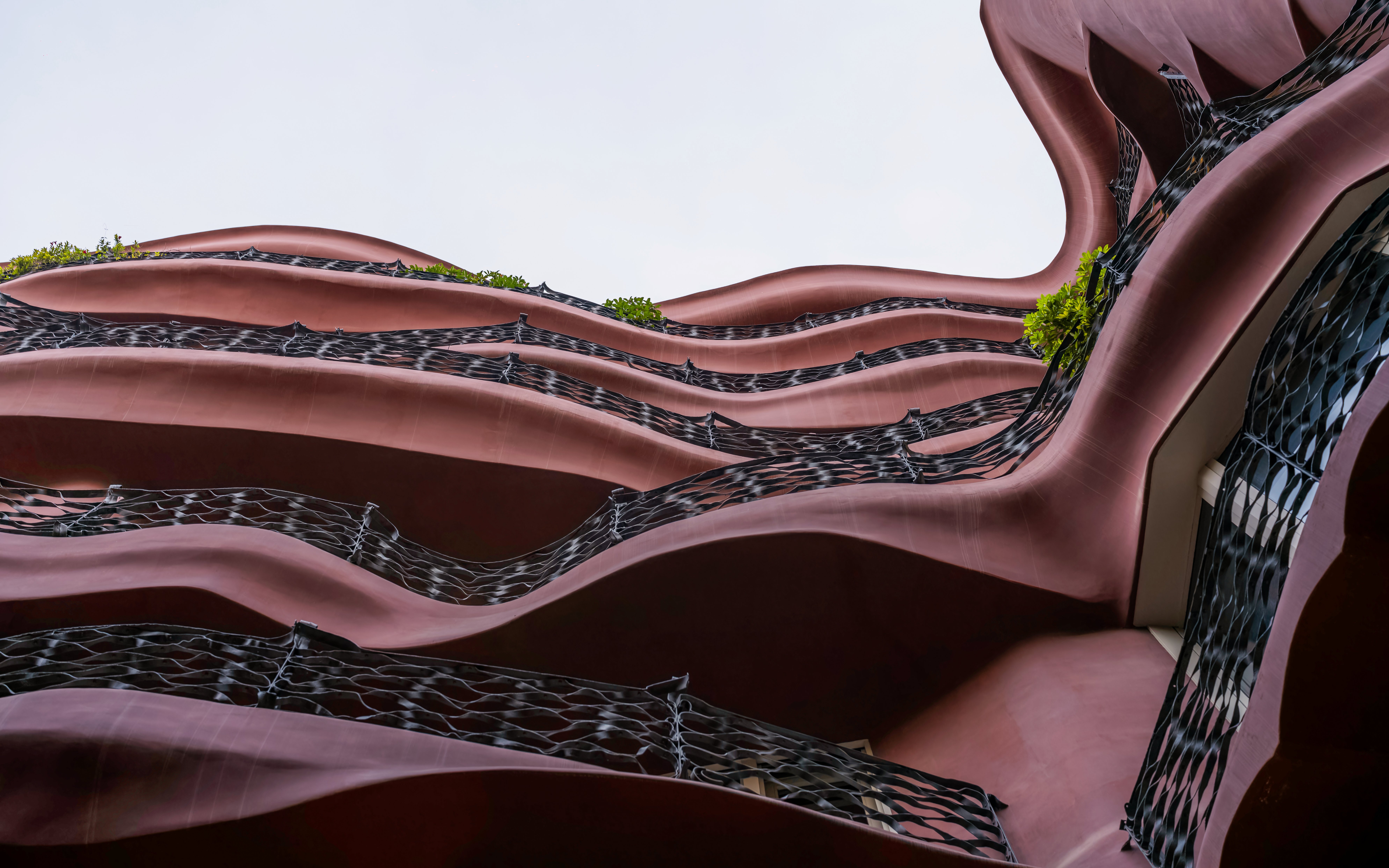 Wavy facade of Casa Mila, La Pedrera in Barcelona, showcasing unique architectural design.