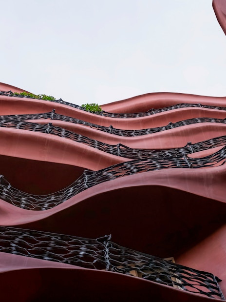Wavy facade of Casa Mila, La Pedrera in Barcelona, showcasing unique architectural design.