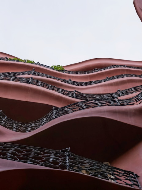 Wavy facade of Casa Mila, La Pedrera in Barcelona, showcasing unique architectural design.