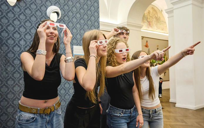Visitors wearing 3D glasses at IAM Illusion Art Museum, Prague.