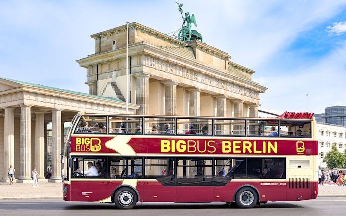 Big Bus Berlin tour passing by the Brandenburg Gate.
