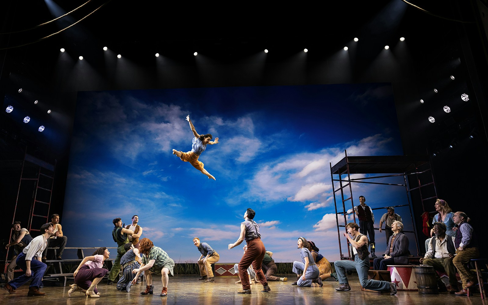 Performer leaping in a circus scene from "Water for Elephants" stage show.