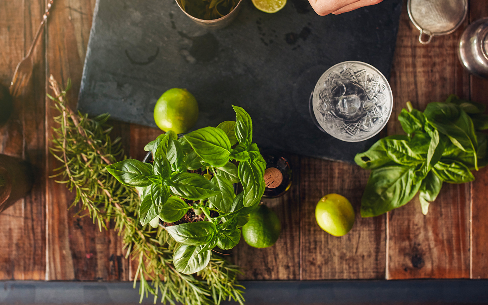 Bartender demonstrating cocktail making at a rooftop bar in New York City.
