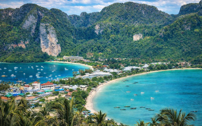 Aerial view of Phi Phi Islands with turquoise waters and lush cliffs, Thailand.