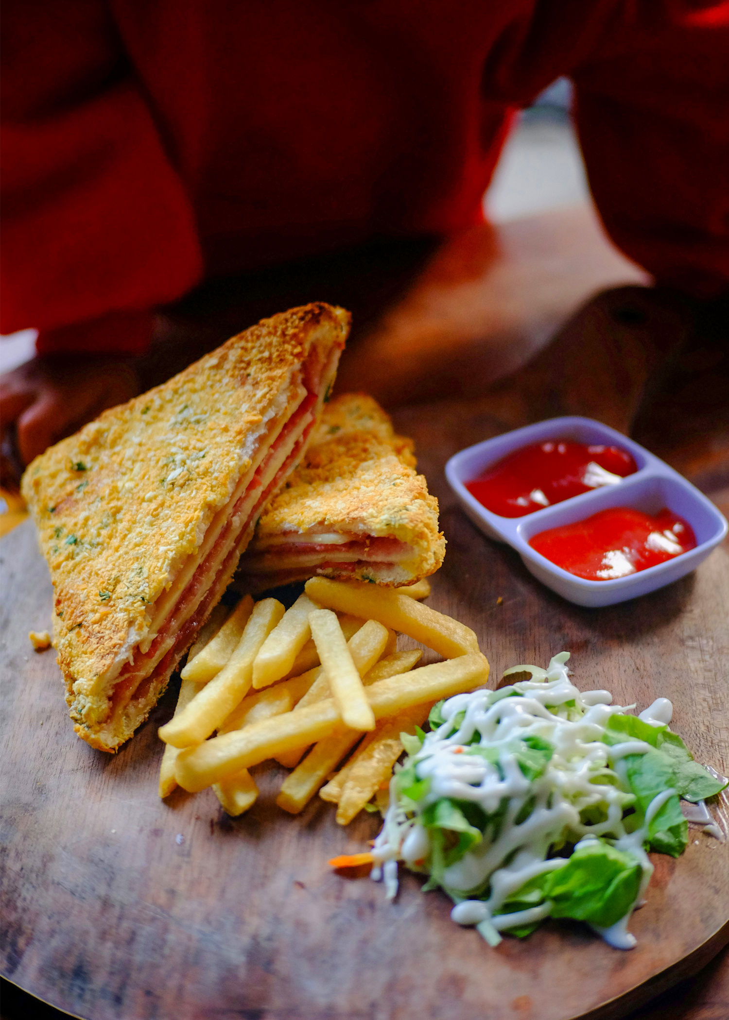 Fries and sandwich with salad at Champions Old Trafford.