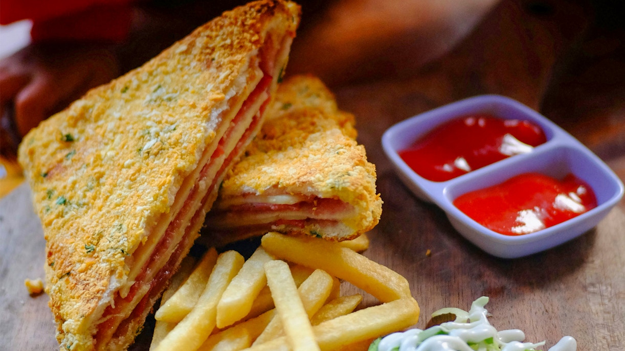 Fries and sandwich with salad at Champions Old Trafford.