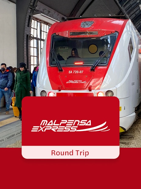 Passengers boarding Malpensa Express train at Milan Central Station.